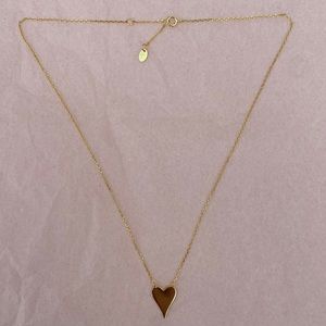 Never worn, brand new. Gold heart necklace.